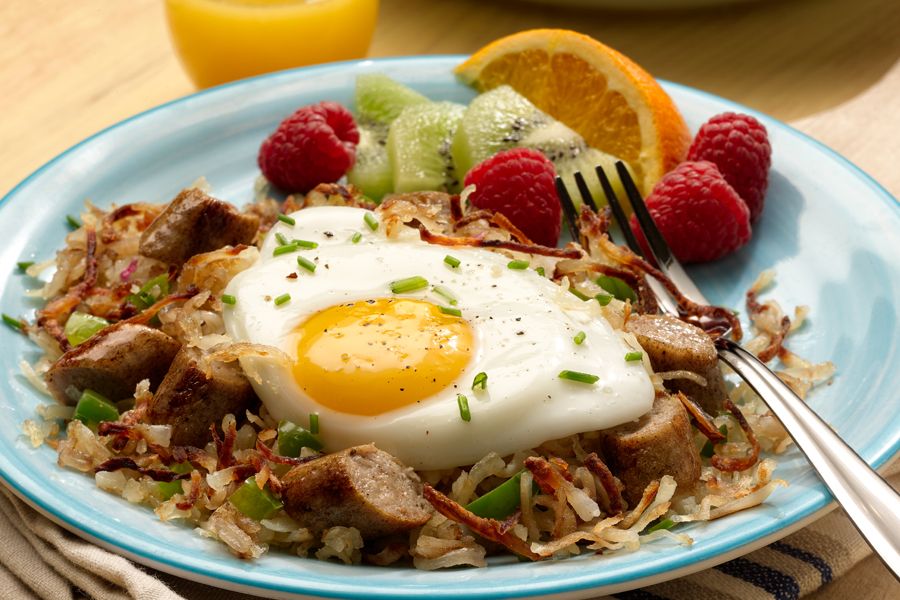 Country style chicken sausage breakfast hash with an egg
