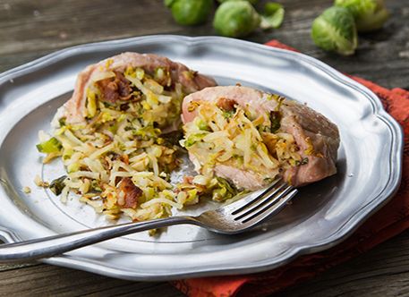 Pork chops stuffed with hash browns, bacon and Brussels sprouts